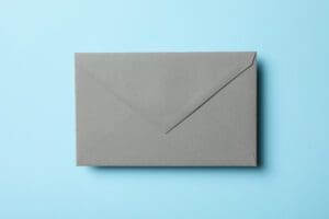 A closed gray envelope is centered on a light blue background.