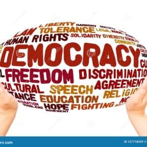 Two hands hold an oval shape filled with words like "Democracy," "Freedom," "Human Rights," "Tolerance," and "Education" in various fonts and colors.