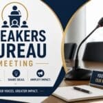 A conference table with a microphone, notepad, and a sign reading "Your Voice, Our Mission" promoting a Speakers Bureau Meeting focused on collaboration, sharing ideas, and amplifying impact.