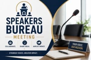 A conference table with a microphone, notepad, and a sign reading "Your Voice, Our Mission" promoting a Speakers Bureau Meeting focused on collaboration, sharing ideas, and amplifying impact.